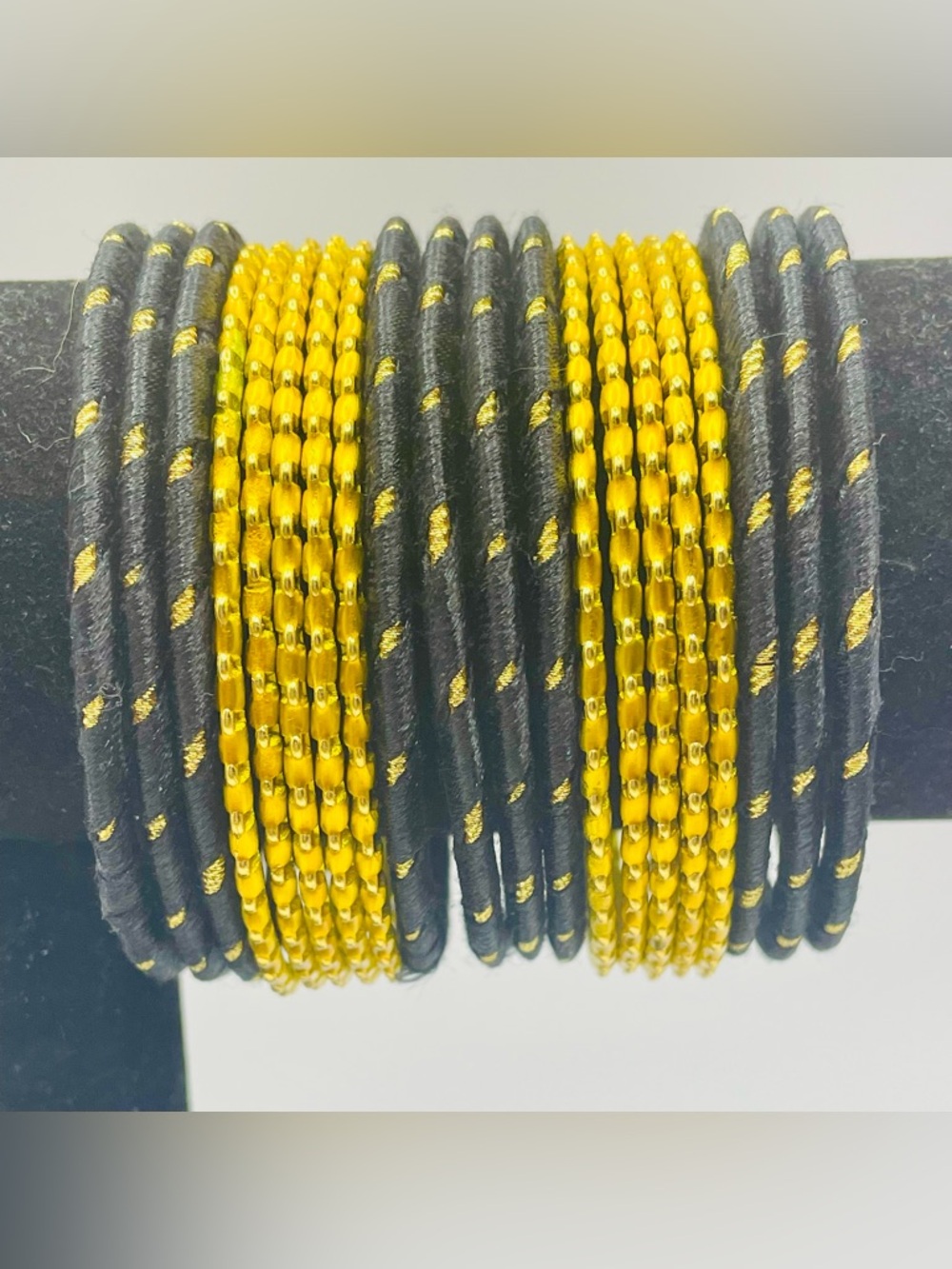 Black and Gold Metal and Thread Bangle Set. 20 bracelets. Sz. 7 1/4 to 7 3/4